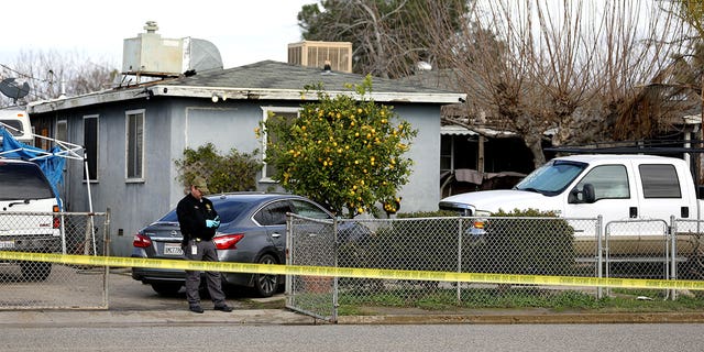 GOSHEN, CA - JANUARY 16: Tulare County Sheriff crime unit investigates the scene where six people, including a 6-month-old baby, her teenage mother and an elderly woman, were killed in a Central Valley farming community in what the local sheriff said was likely a targeted attack by a drug cartel on Monday, Jan. 16, 2023 in Goshen, CA. The massacre occurred around 3:30 a.m. in and around a residence in the Tulare County town of Goshen near Visalia. (Gary Coronado / Los Angeles Times via Getty Images)