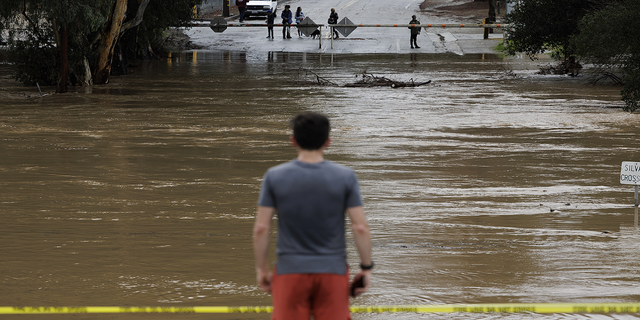 Uvas Creek floods a section of Miller Avenue in Gilroy, California, as the latest series of atmospheric rivers hit the Bay Area on Jan. 9, 2023.