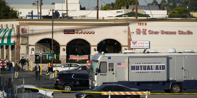 Investigators are seen outside the Star Dance Studio in Monterey Park, California, on Sunday, Jan. 22.