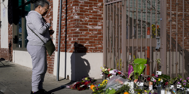 Yolanda Gallegos, 72, prays for victims killed in a shooting outside Star Dance Studio in Monterey Park, California, on Monday, Jan. 23.