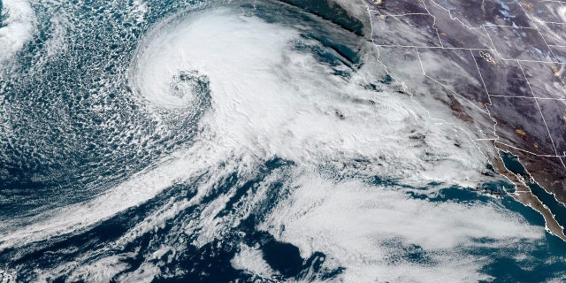 This satellite image made available by NOAA shows a storm system approaching the U.S. West coast on Tuesday, Jan. 3, 2023, at 6:36 p.m. EST. (NOAA via AP)