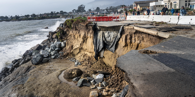 A portion of West Cliff Drive fell into the Pacific Ocean after a series of powerful storms of rain and high winds hit California's Central Coast in Santa Cruz, California on Sunday Jan. 8.