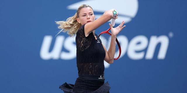 Camila Giorgi returns a shot against Madison Keys in their women's singles match at the U.S. Open on Aug. 31, 2022, in Queens, New York.