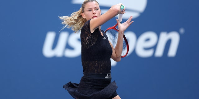 Camila Giorgi returns a shot against Madison Keys in their women's singles match at the U.S. Open on Aug. 31, 2022, in Queens, New York.