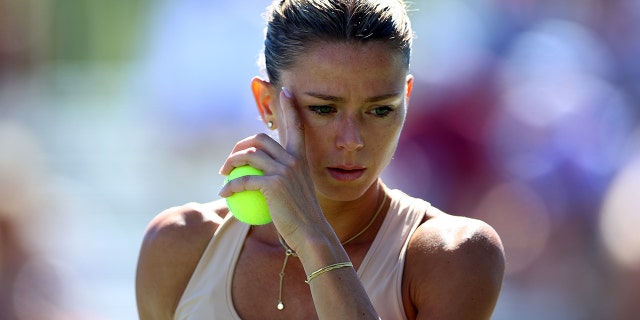 Italian tennis star embroiled in fake vaccine certificate scandal Camila Giorgi prepares to serve during the National Bank Open at Sobeys Stadium on Aug. 11, 2022 in Toronto, Canada.