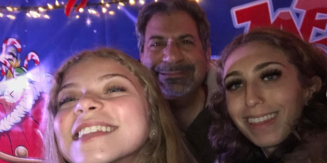 Carlo Secondino shared a photo to Facebook smiling with his two daughters.