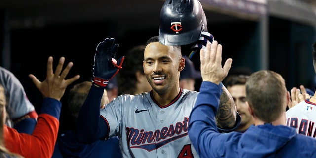 Carlos Correa (4) of the Minnesota Twins celebrates with teammates in the dugout after hitting a two-run home run against the Detroit Tigers during the seventh inning at Comerica Park on September 30, 2022 in Detroit.