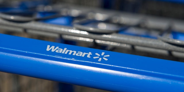 Walmart Stores Inc logo.  on a shopping cart in front of a store in American Canyon, California on February 16, 2012. 