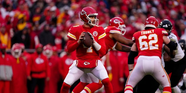 Chad Henne (4) of the Kansas City Chiefs looks to throw a pass against the Jacksonville Jaguars during the second quarter in an AFC divisional playoff game at Arrowhead Stadium on January 21, 2023 in Kansas City, Missouri.