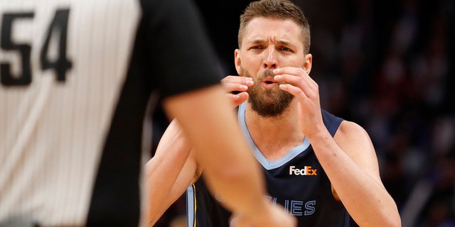 Memphis Grizzlies forward Chandler Parsons, #25, reacts to a call from referee Ray Acosta, #54, during the fourth quarter against the Detroit Pistons at Little Caesars Arena in Detroit on April 9, 2019.