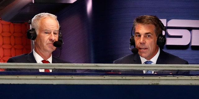 John McEnroe, left, and Chris Fowler announce a match at the US Open on August 27, 2018 in New York.