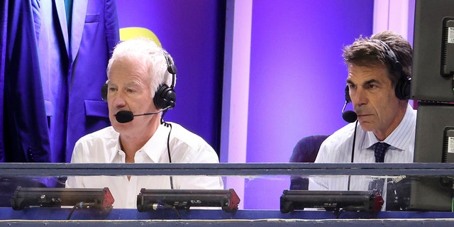 John McEnroe, left, and Chris Fowler call a match at the US Open on September 9, 2022 in New York.