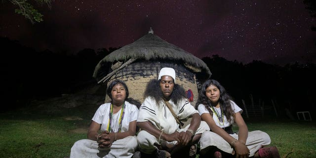 The Arhuacos follow the original law as a guide for behavior and spiritual knowledge, in how they live with Mother Nature.  Pictured are the Arhuaco siblings. 