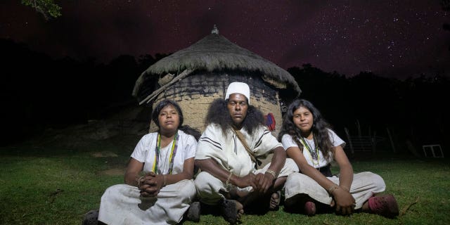 Arhuacos follow the Law of Origin as their guide to behavior and spiritual knowledge, in how they live with Mother Nature. Pictured are Arhuaco siblings. 