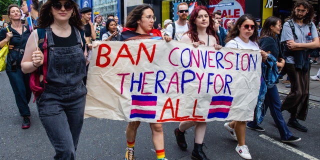 LGBT campaigners join Gay Liberation Front veterans marking the 50th anniversary of the first U.K. Pride march in 1972 on July 1, 2022, in London.