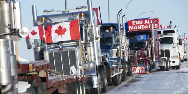 Lines of trucks block the U.S.-Canada border during a demonstration in Coutts, Alberta, on Feb. 2, 2022, a day before Pastor Artur Pawlowski delivered a speech that landed him in prison.