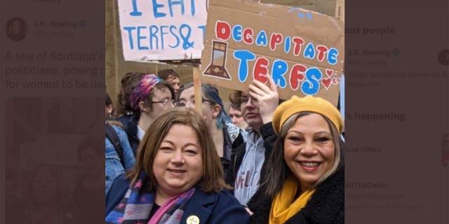 Members of Parliament stood in front of a sign reading "Decapitate TERFs" at a trans rights demonstration on Saturday.