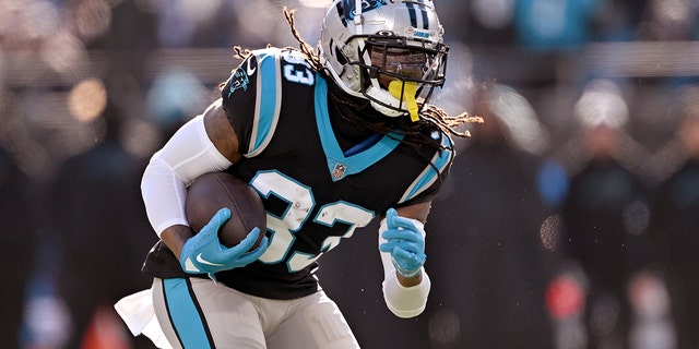 D'Onta Foreman of the Panthers runs against the Detroit Lions at Bank of America Stadium on December 24, 2022 in Charlotte, North Carolina.