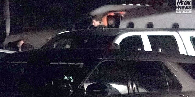 Bryan Kohberger is escorted off of a plane by law enforcement in Pullman, Washington on Wednesday, January 4, 2023. Kohberger has been extradited from Pennsylvania to face charges for the murder of four University of Idaho students in November last year.