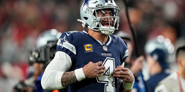 Dallas Cowboys quarterback Dak Prescott (4) warms up before an NFL wild-card football against the Tampa Bay Buccaneers, Monday, Jan. 16, 2023, in Tampa, Fla.