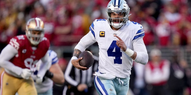 Dallas Cowboys quarterback Dak Prescott, #4, runs during the second quarter of an NFC divisional round game against the San Francisco 49ers at Levi's Stadium in Santa Clara, California on January 22 of 2023.