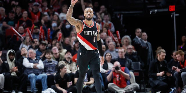 Damian Lillard #0 of the Portland Trail Blazers gestures after making a three point basket during the second half against the Utah Jazz at Moda Center on January 25, 2023, in Portland, Oregon.
