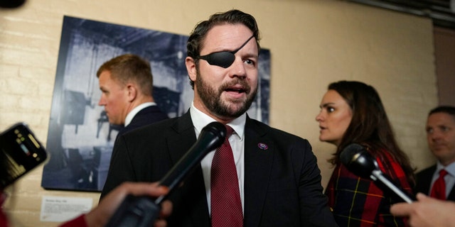 Rep.-elect Dan Crenshaw, R-Texas, speaks to media on Capitol Hill on the opening day of the 118th Congress at the U.S. Capitol in Washington, D.C., on Tuesday.