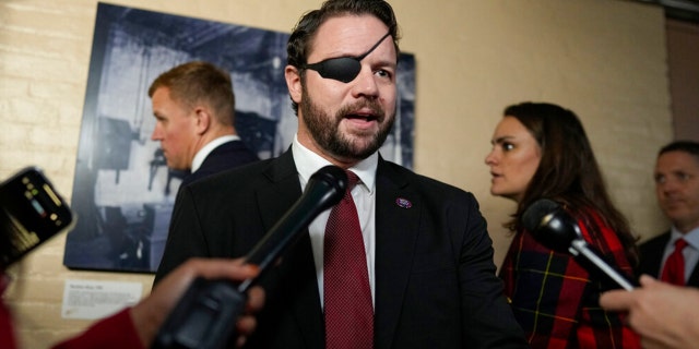 Rep.-elect Dan Crenshaw, R-Texas, speaks to media on Capitol Hill on the opening day of the 118th Congress at the U.S. Capitol in Washington, D.C., on Tuesday.