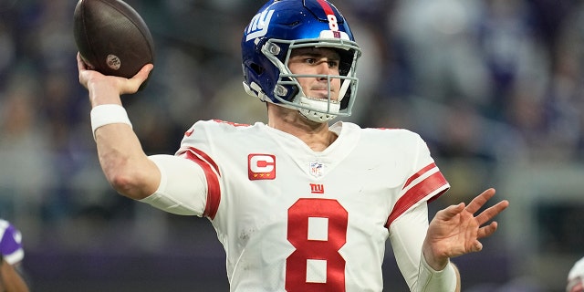 Sunday, Jan. 15, 2023, New York Giants' Daniel Jones throws during the first half of an NFL Wild Card football game against the Minnesota Vikings in Minneapolis.