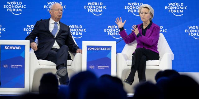 President of the European Commission Ursula von der Leyen, right, speaks as WEF founder Klaus Schwab listens during a session of the World Economic Forum annual meeting in Davos on Jan. 17, 2023. (Fabrice Coffrini / AFP via Getty Images)