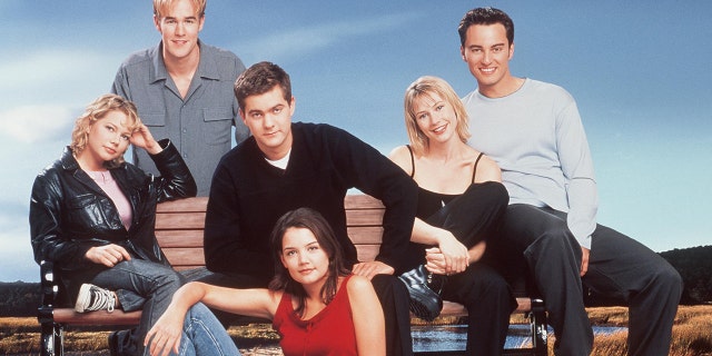 The cast of "Dawson's Creek" (Season 3). Back row: James Van Der Beek. Middle row: Michelle Williams, Joshua Jackson, Meredith Monroe and Kerr Smith. Front row: Katie Holmes.