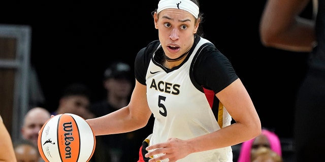 Las Vegas Aces' Dearica Hamby dribbles up court against the Mercury, on May 6, 2022, in Phoenix.