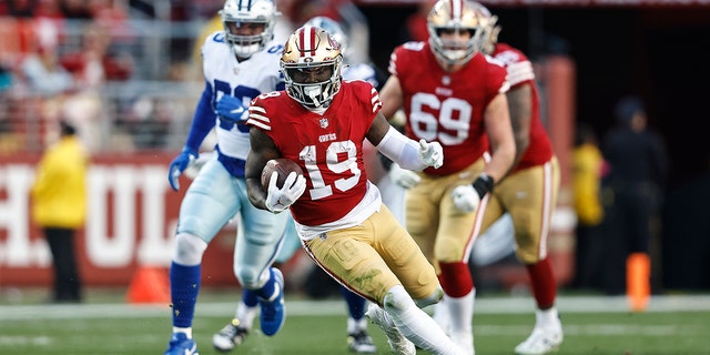 Deebo Samuel, #19 of the San Francisco 49ers, runs with the ball during an NFL divisional round playoff football game between the San Francisco 49ers and the Dallas Cowboys at Levi's Stadium on Jan. 22, 2023 in Santa Clara, California.