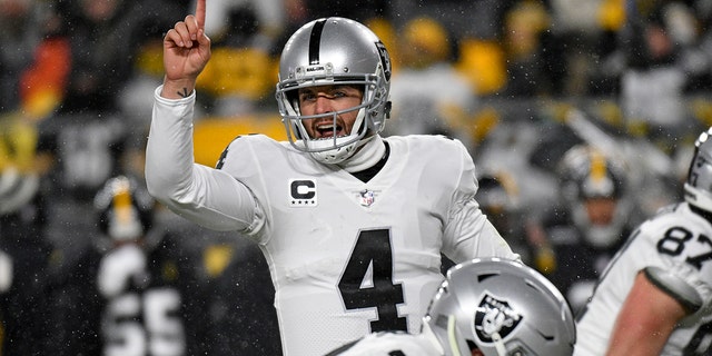 Las Vegas Raiders quarterback Derek Carr (4) signals during the first half of an NFL football game against the Pittsburgh Steelers in Pittsburgh, Saturday, Dec. 24, 2022. 