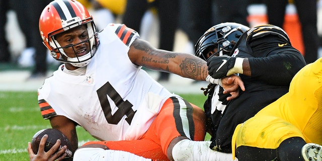 Cleveland Browns quarterback Deshaun Watson is sacked by Pittsburgh Steelers defensive tackle Larry Ogunjobi during the second half of an NFL football game in Pittsburgh, Sunday, Jan. 8, 2023.