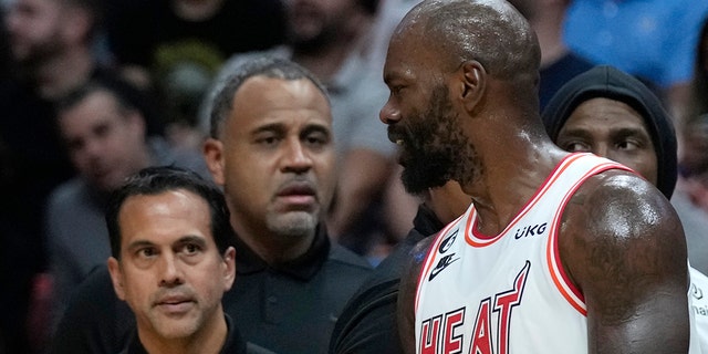 Miami Heat center Dwayne Dedman, #21, argues with head coach Erik Spoelstra before leaving the court during the first half of an NBA basketball game against the Oklahoma City Thunder on Tuesday, Jan. 10, 2023, in Miami.