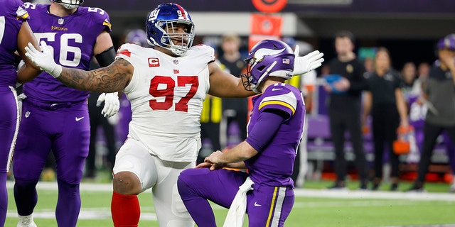 Dexter Lawrence #97 of the New York Giants reacts after sacking Kirk Cousins #8 of the Minnesota Vikings during the second quarter in the NFC Wild Card playoff game at U.S. Bank Stadium on January 15, 2023 in Minneapolis.