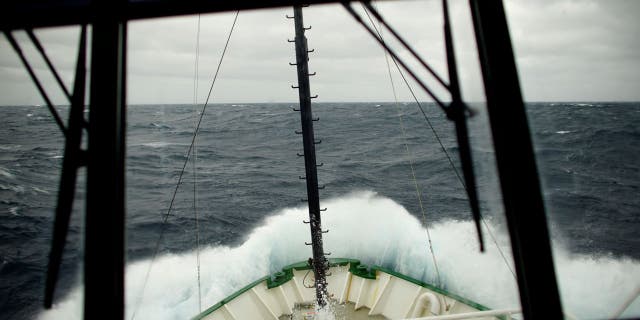 Waves break on the Greenpeace ship Arctic Sunrise in the Drake Passage as it navigates toward the Antarctic Peninsula on Feb. 10, 2018.