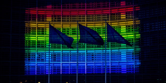 European Commission headquarters lit up in the colors of the rainbow flag in support of the LGBT community in Brussels, Belgium, on May 16, 2020.