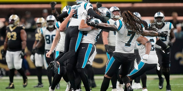 Carolina Panthers placekicker Eddy Pineiro celebrates with teammates after kicking the winning field goal during the second half of an NFL football game between the Carolina Panthers and the New Orleans Saints in New Orleans, Sunday, January 8, 2023.