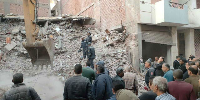 Debris removal works are underway after a five-story building collapses in Asyut, Egypt, on Jan. 8, 2023. At least six casualties were reported. It is not clear on what caused the building to crumble.