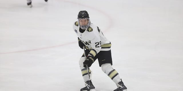 Army hockey player Eric Huss skates on the ice