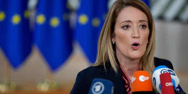 European Parliament President Roberta Metsola speaks with the media at an EU summit in Brussels on Dec. 15, 2022. Metsola, on Jan. 2, 2023, launched an urgent procedure for the waiver of immunity of two lawmakers following an investigation that is looking into a political scandal within the European Union.