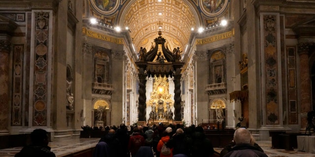 Mourners enter St. Peter's Basilica where the body of Pope Emeritus Benedict XVI lies in state inside at The Vatican, Wednesday, Jan. 4, 2023.