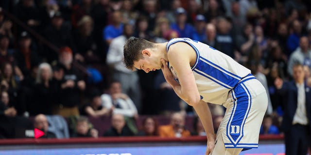 Duke Blue Devils center Kyle Filipowski (30) grabs his neck in the second half during a game against the Virginia Tech Hokies at Cassell Coliseum on January 23, 2023 in Blacksburg, Virginia.