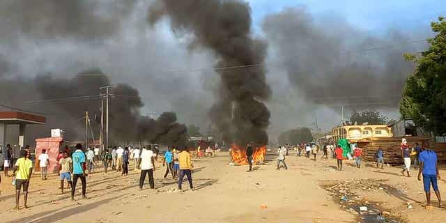 Anti-government demonstrators set a barricade on fire during clashes in N'Djamena, Chad, on Oct. 20, 2022. Chad’s government foiled an attempt to destabilize the country and undermine the constitution, according to a government spokesman in a statement on Jan. 5, 2023. 