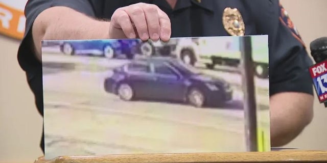 Lakeland, Florida authorities display an image of a sedan being sought in connection with Monday's drive-by shooting. 