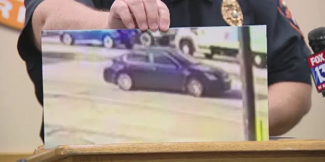 Lakeland, Florida authorities display an image of a sedan being sought in connection with Monday's drive-by shooting. 