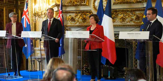 French Foreign Minister Catherine Colonna, second right, French Defense Minister Sebastien Lecornu, right, attend a joint press conference with Australian Defense Minister Richard Marles, second left, and Australian Foreign Minister Penny Wong, on Jan. 30, 2023. Australia and France are jointly sending artillery shells to Ukraine.