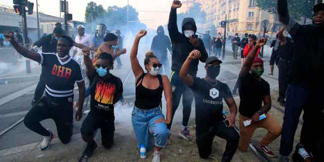 Protesters gesture during a demonstration against police racial injustice, on June 2, 2020, in Paris. French Prime Minister Elisabeth Borne announced a new plan on Jan. 30, 2023, to defeat racism, anti-Semitism, and discrimination of all kinds in the country.